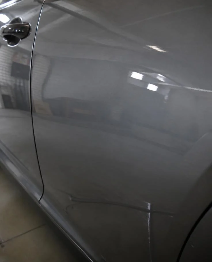 Freshly resprayed car panel with a smooth colour-matched finish — TKM Smash Repairs, Edmonton QLD